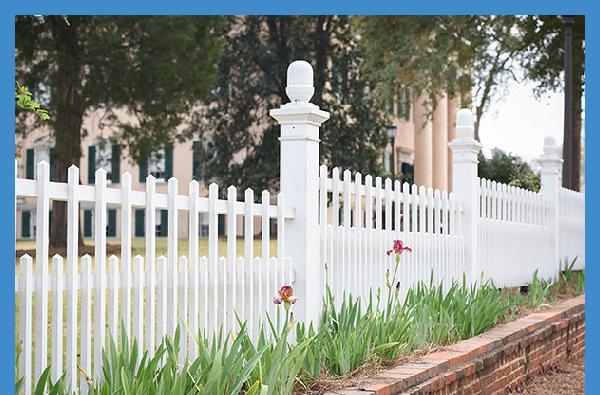 Vibrant irises align the fence at Georgia&rsquo;s Old Governor&rsquo;s Mansion