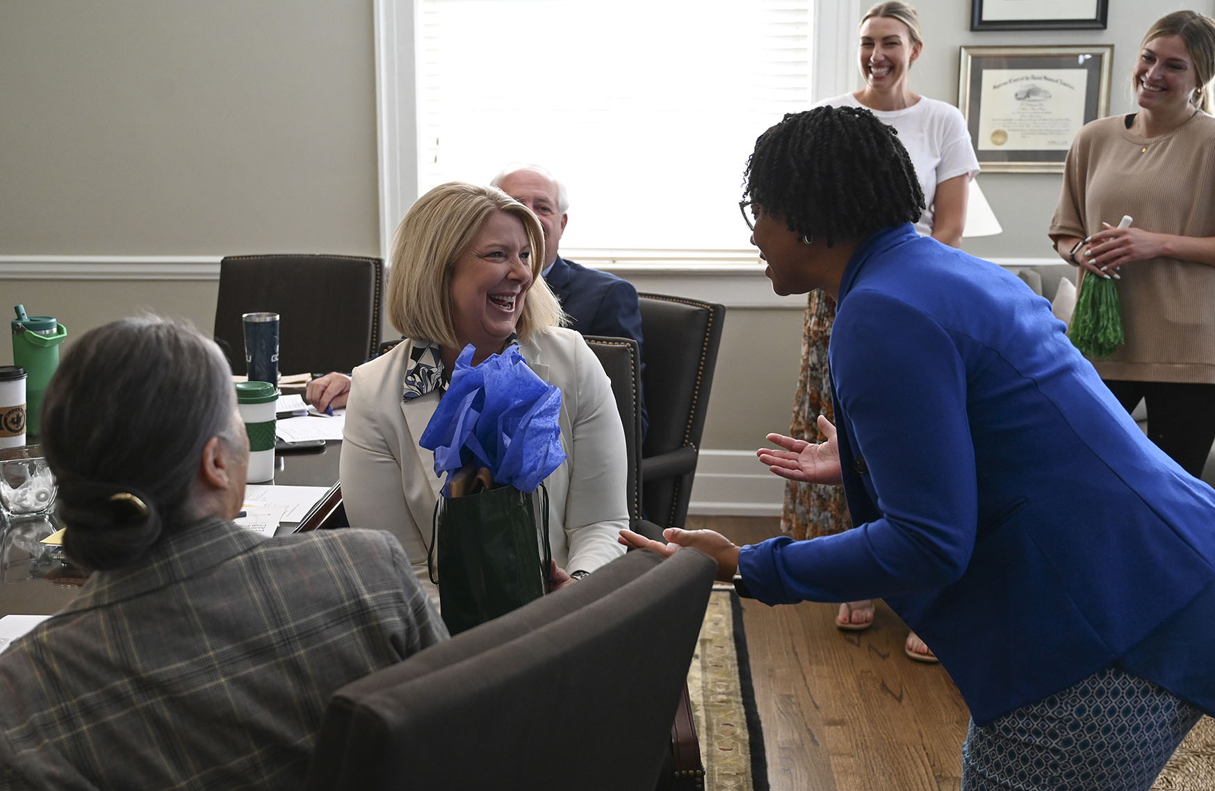 The Alumni Association surprised Dr. Roberts with alumni gifts during a cabinet meeting.
