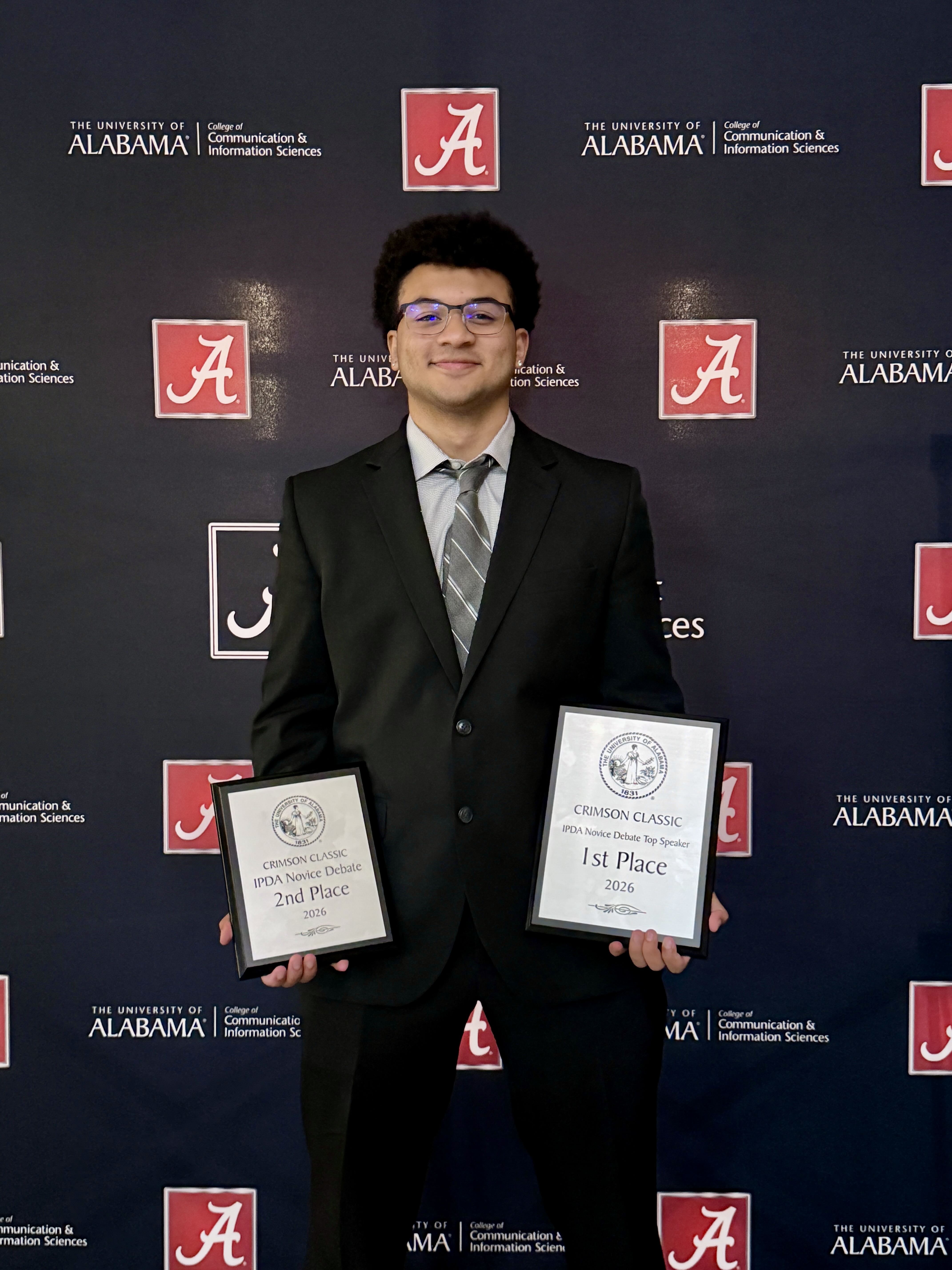 Mason Nixon holds his trophies