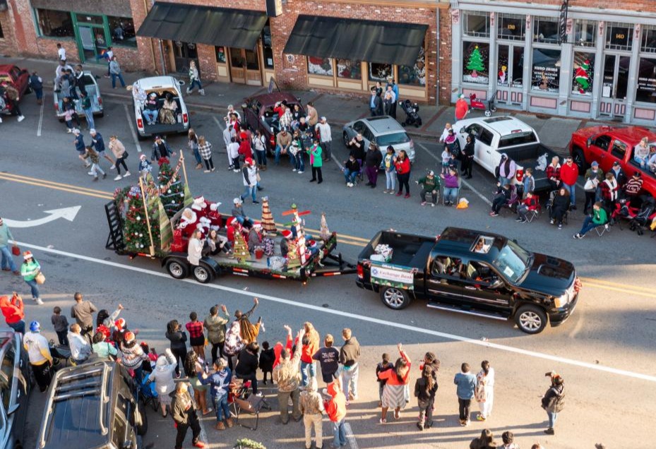 An image of a decorated float driving through downtown Milledgeville